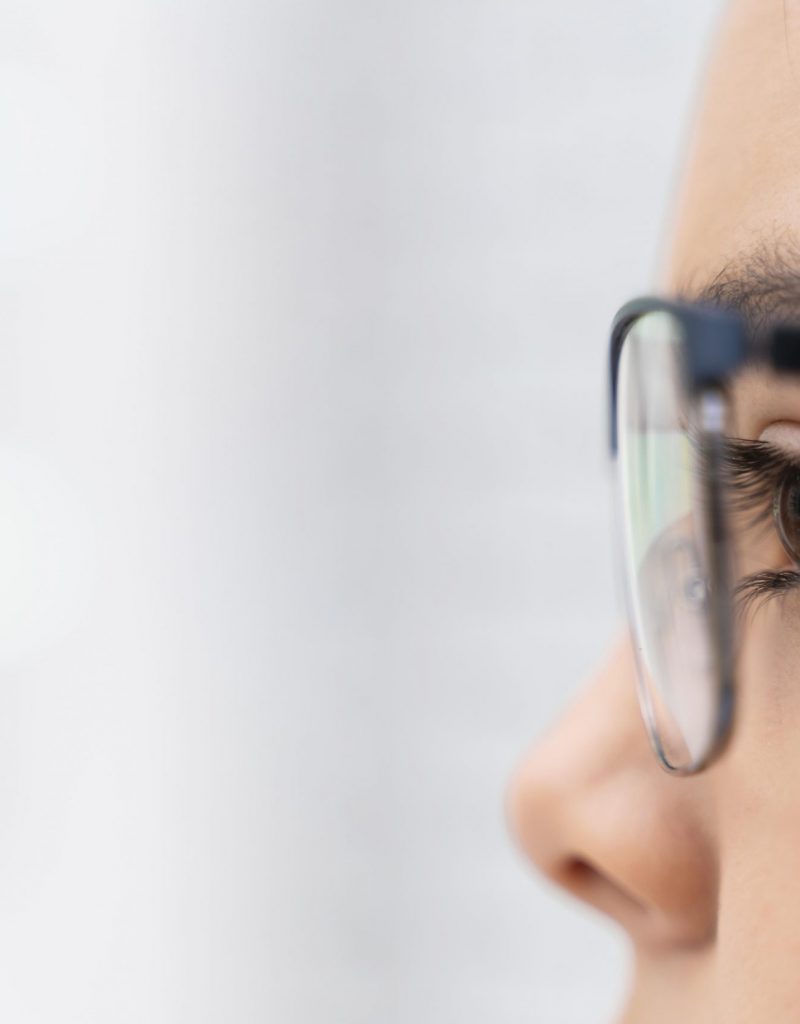 girl-store-trying-glasses-close-up