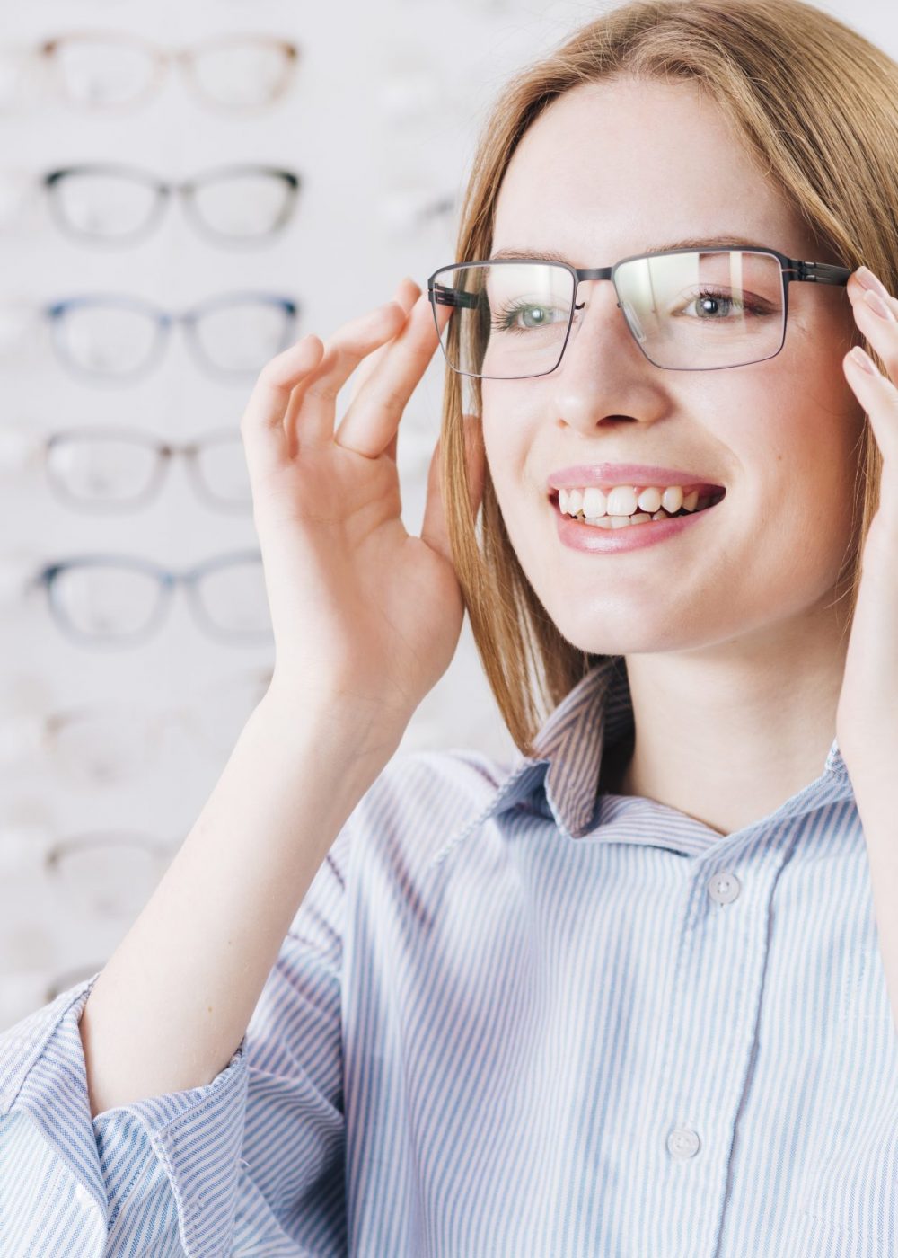 happy-woman-looking-new-glasses-optometrist