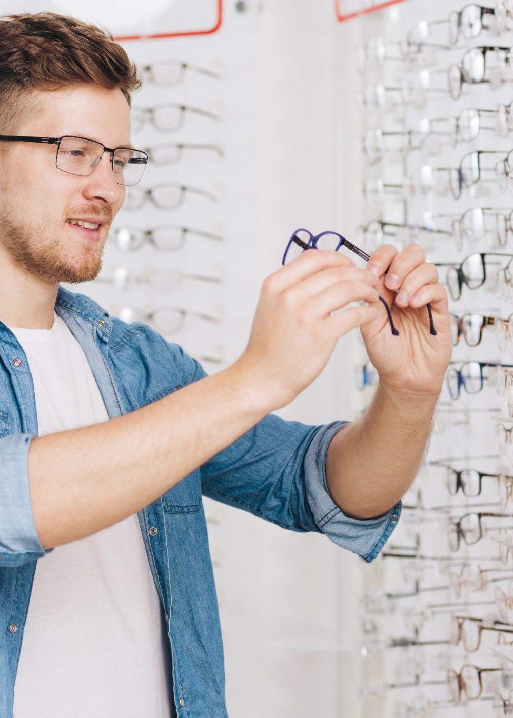 man-looking-new-glasses-optometrist